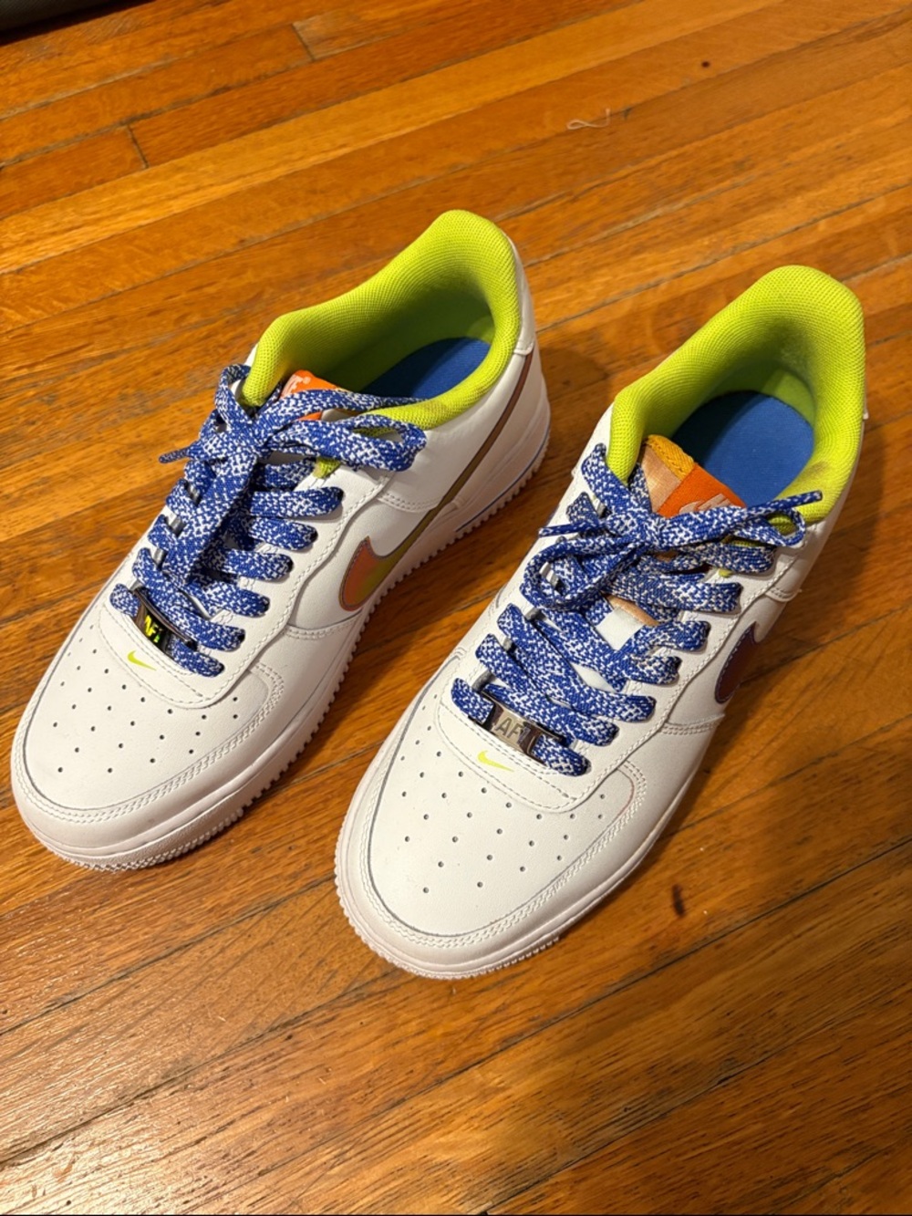 Kids White Sneakers with Neon Green Lining and Blue & White Laces.